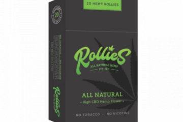 Pack of Rollies hemp cigarettes standing upright with a white background. The box is black with lime green writing.