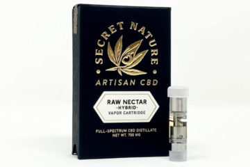 Secret Nature Raw Nectar Full Spectrum CBD vape cartridge standing upright next to its box.