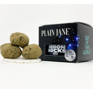 Three Plain Jane moon rocks sitting next to the 8th jar and box.