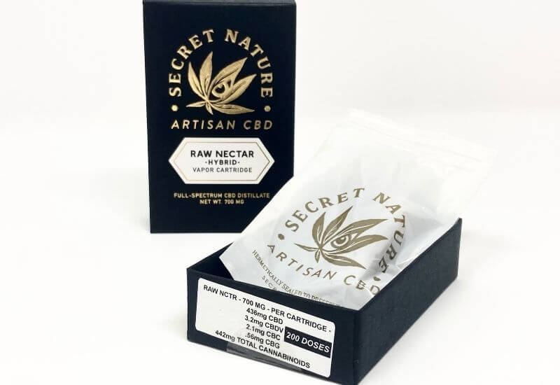 Secret Nature raw nectar vape cartridge box open with the contents hanging out.